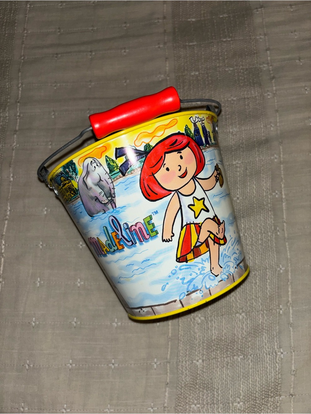 Madeline Yellow Pail with Red Handle and Red-Head Character